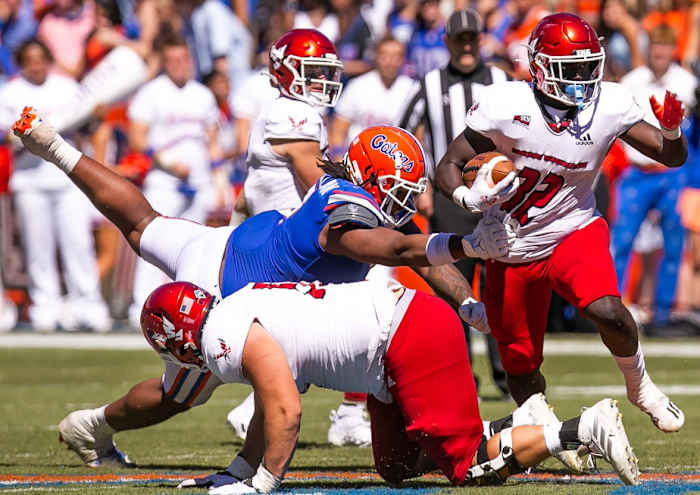 Florida Gators defensive lineman Gervon Dexter Sr. (9) tackles Eastern Washington Eagles running back Tuna Altahir (32) in the second half at Steve Spurrier Field at Ben Hill Griffin Stadium in Gainesville, FL on Sunday, October 2, 2022. [Doug Engle/Gainesville Sun] Ncaa Football Florida Gators Vs Eastern Washington Eagles