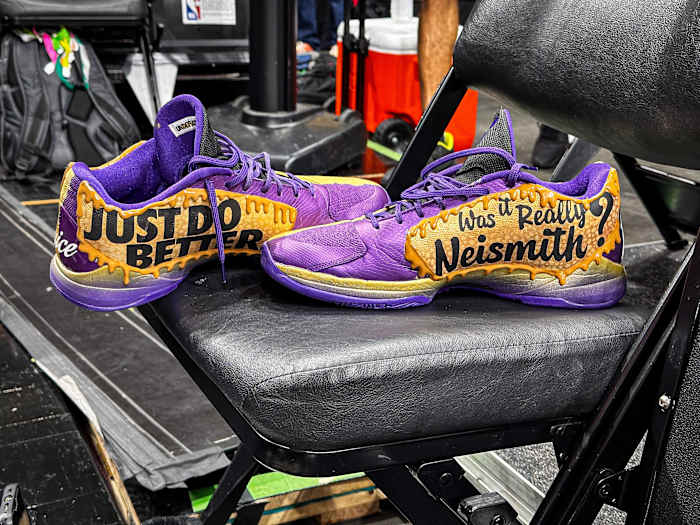 View of Jaylen Brown's purple and brown shoes.