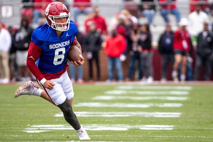 Oklahoma Sooners quarterback Dillon Gabriel runs the ball during a scrimmage.