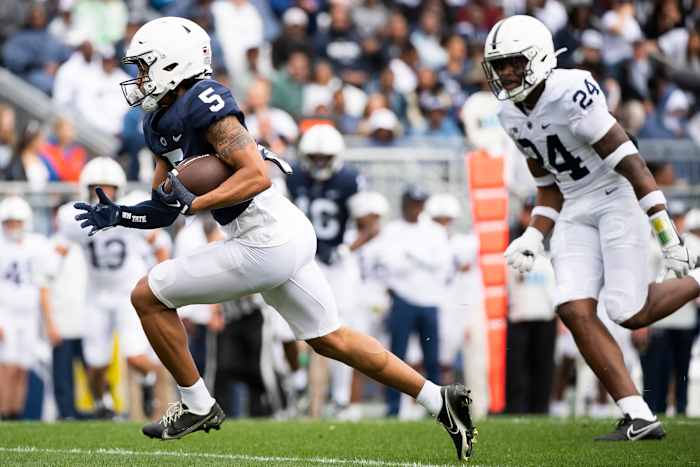 Penn State wide receiver Omari Evans runs with the football.
