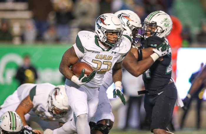 UAB Blazers running back DeWayne McBride (22) runs the ball against the Marshall Thundering Herd during the fourth quarter at Joan C. Edwards Stadium.