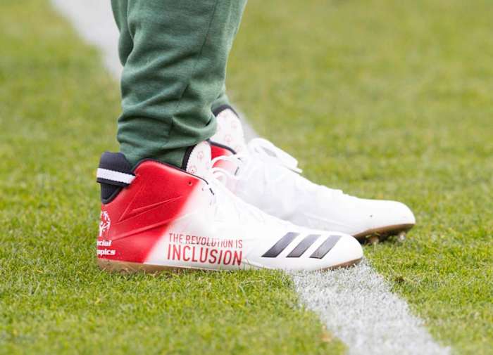 View of Aaron Rodgers' white and red Adidas cleats.