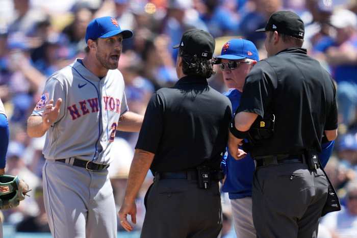 Max Scherzer argues with an umpire after being checked for a sticky substance during a MLB game.