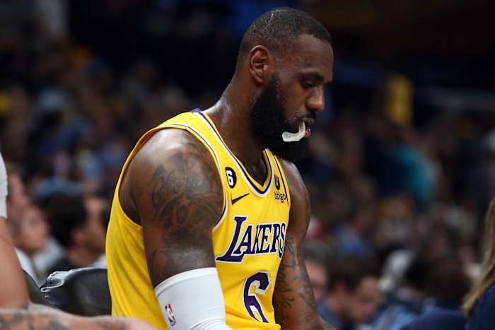 Los Angeles Lakers forward LeBron James (6) sits on the bench during a timeout during the second half against the Memphis Grizzlie