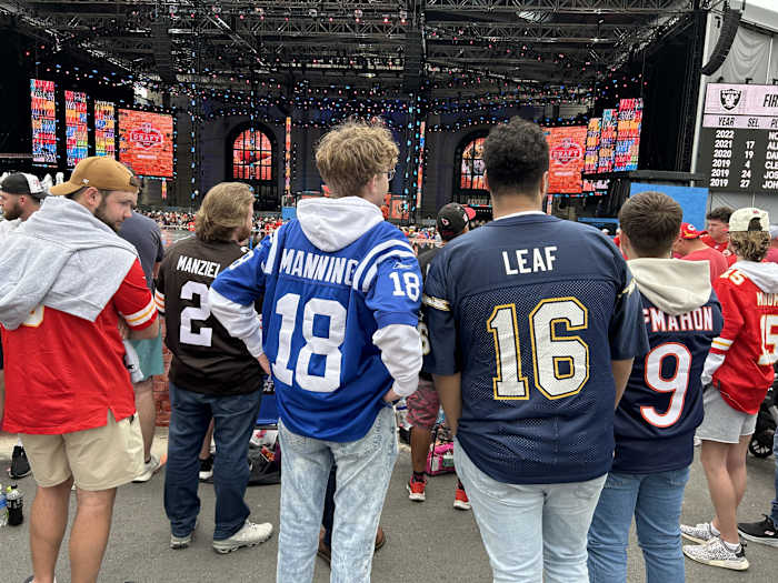 The perfect picture for how some NFL drafts go great for one team (Peyton Manning and the Indianapolis Colts) and not so great for others (Ryan Leaf and the San Diego Chargers). A perfect fan shot from Kansas City. (AllTitans.com photo by Tom Brew)