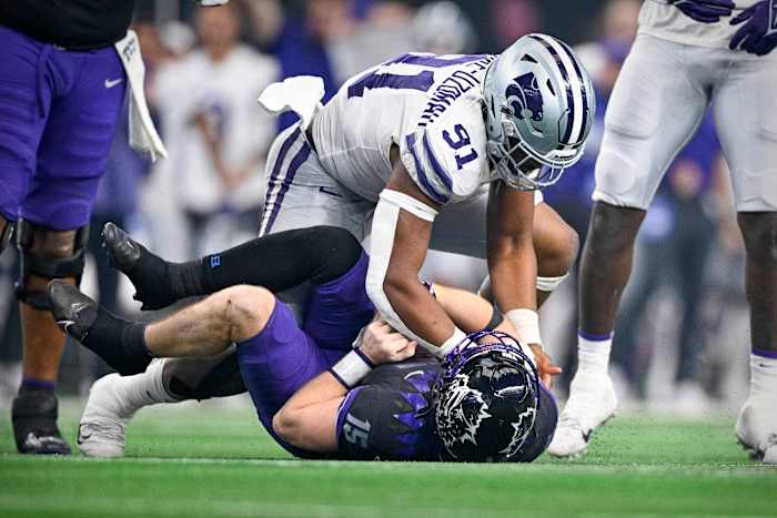 Dec 3, 2022; Arlington, TX, USA; Kansas State Wildcats defensive end Felix Anudike-Uzomah (91) sacks TCU Horned Frogs quarterback Max Duggan (15) during the second half at AT&T Stadium. Mandatory Credit: Jerome Miron-USA TODAY Sports