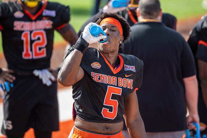 Jan 31, 2023; Mobile, AL, USA; National defensive lineman KJ Henry of Clemson (5) takes a water break during the first day of Senior Bowl week at Hancock Whitney Stadium in Mobile.