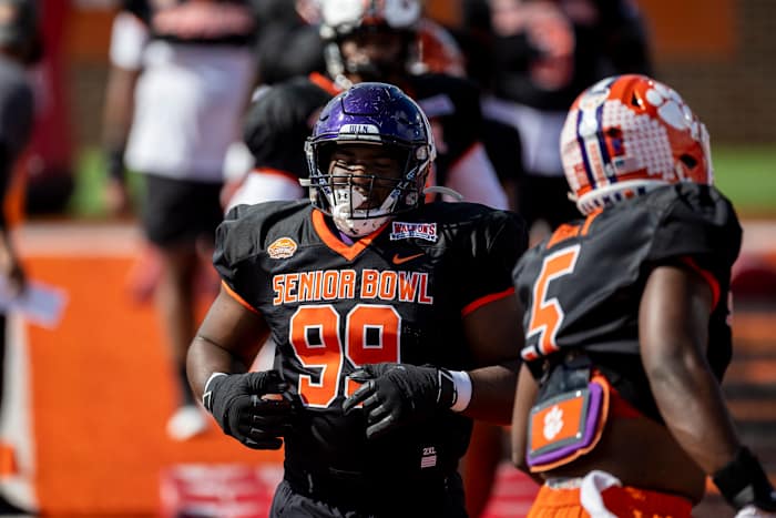 Jan 31, 2023; Mobile, AL, USA; National defensive lineman Adetomiwa Adebawore of Northwestern (99) practices during the first day of Senior Bowl week at Hancock Whitney Stadium in Mobile. Mandatory Credit: Vasha Hunt-USA TODAY Sports