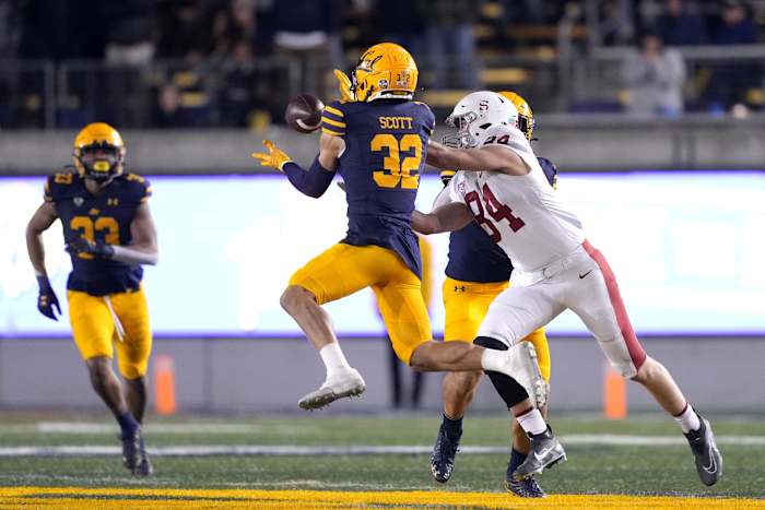 Nov 19, 2022; Berkeley, California, USA; California Golden Bears safety Daniel Scott (32) intercepts a pass intended for Stanford Cardinal tight end Benjamin Yurosek (84) during the fourth quarter at FTX Field at California Memorial Stadium. Mandatory Credit: Darren Yamashita-USA TODAY Sports