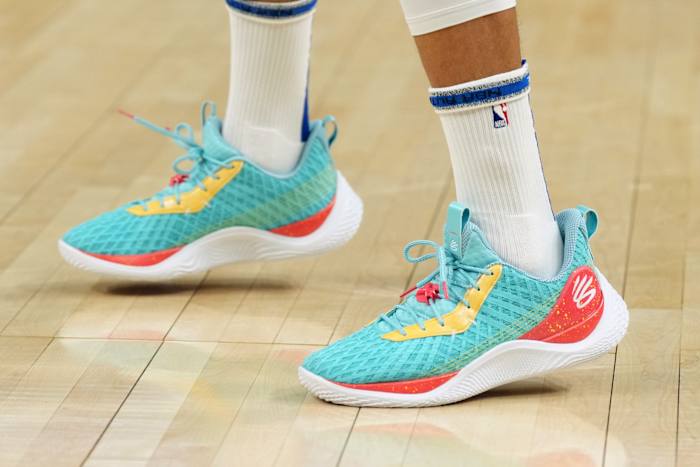 View of Stephen Curry's teal and red Under Armour shoes.