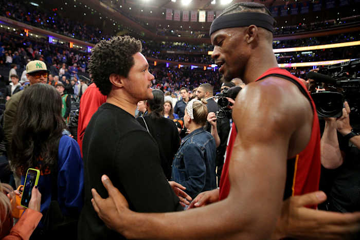 Trevor Noah talks to Miami Heat forward Jimmy Butler after a game.