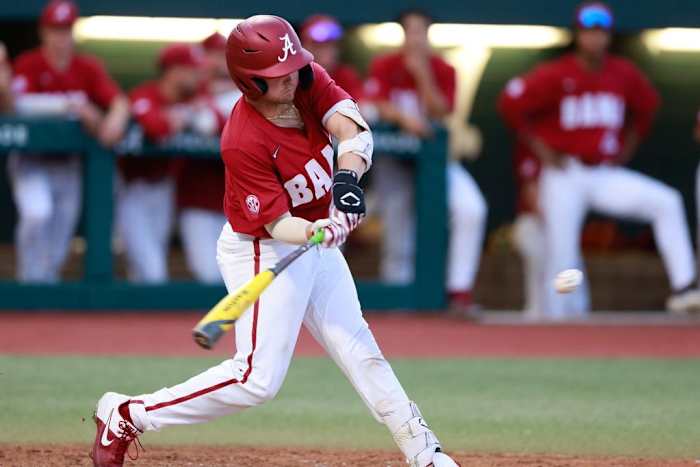 Alabama baseball player Mac Guscette (9) hits the ball against Samford at Sewell-Thomas Stadium in Tuscaloosa, AL on Tuesday, Apr 25, 2023.