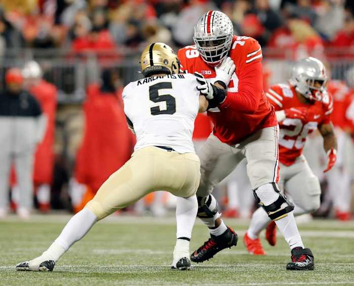 Ohio State Buckeyes offensive lineman Dawand Jones (79) blocks Purdue Boilermakers defensive end George Karlaftis (5) during the 4th quarter of their NCAA game at Ohio Stadium in Columbus, Ohio on November 13, 2021. Osu21pur Kwr 39