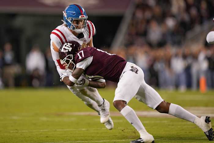 Oct 29, 2022; College Station, Texas, USA; Texas A&M Aggies defensive back Jaylon Jones (17) tackles Mississippi Rebels quarterback Jaxson Dart (2) in the first half at Kyle Field. Mandatory Credit: Daniel Dunn-USA TODAY Sports