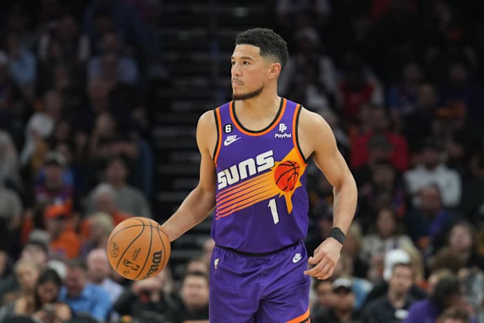 Phoenix Suns guard Devin Booker dribbles the basketball.