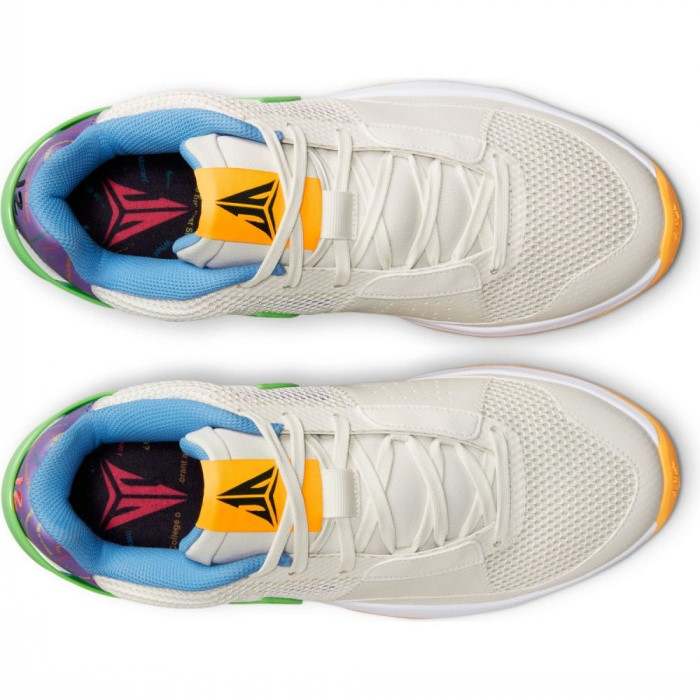 Detailed look at Ja Morant's white and yellow Nike shoes.