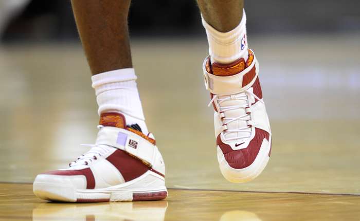 View of white and red Nike LeBron shoes.