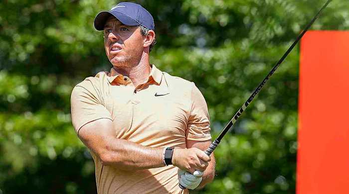 Rory McIlroy watches a tee shot at the 2023 Wells Fargo Championship.