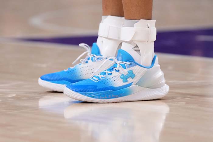 View of Stephen Curry's blue and white Under Armour shoes.