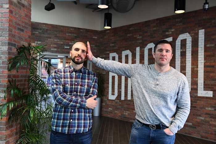 Chael Sonnen & Ariel Helwani pose for the ESPN camera.