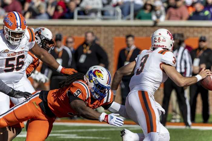 eb 4, 2023; Mobile, AL, USA; National defensive lineman Lonnie Phelps Jr of Kansas (9) sacks American quarterback Clayton Tune of Houston (3) during the first half of the Senior Bowl college football game at Hancock Whitney Stadium. Mandatory Credit: Vasha Hunt-USA TODAY Sports