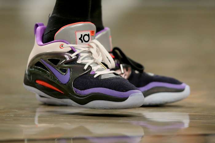 View of Kevin Durant's black and purple Nike shoes.