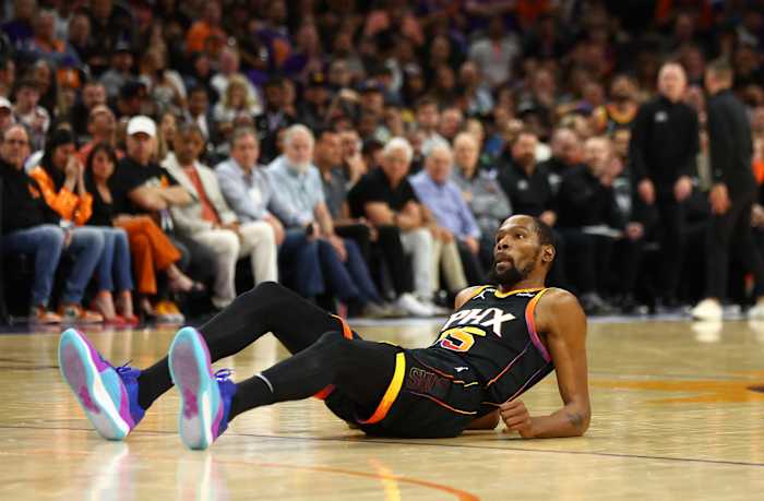 Phoenix Suns forward Kevin Durant falls to the court during a game.