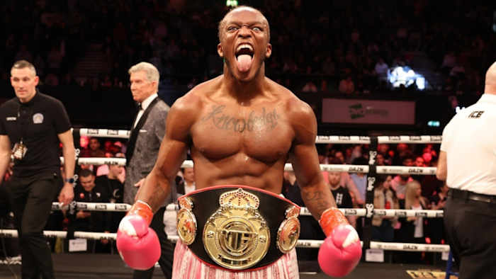 KSI posted with a championship belt after scoring a Misfits Boxing win.