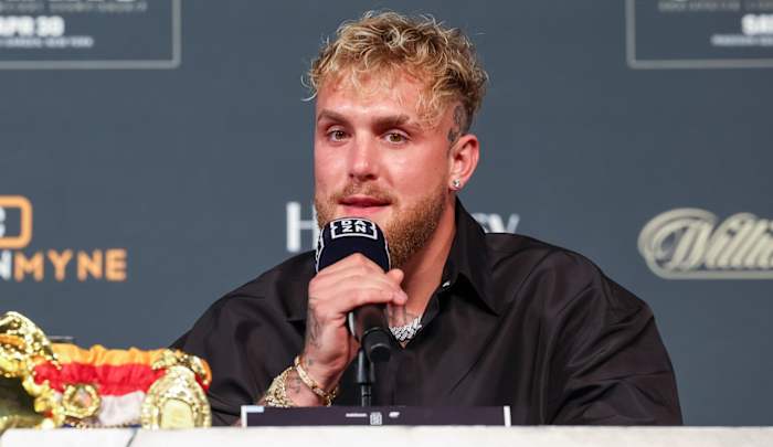 Jake Paul speaking to the media during a press conference ahead of a boxing match.