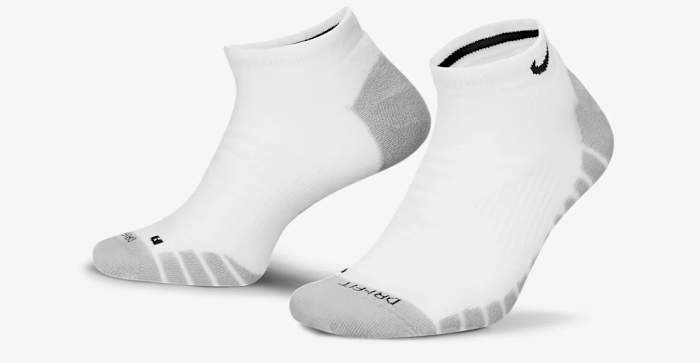 Side view of white and grey Nike socks.
