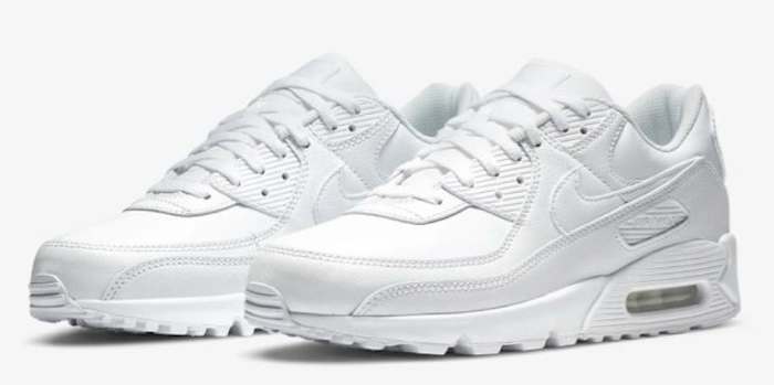 Side view of white Nike sneakers.