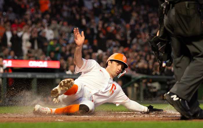 SF Giants shortstop Casey Schmitt slides safely home against the Philadelphia Phillies on May 16, 2023.