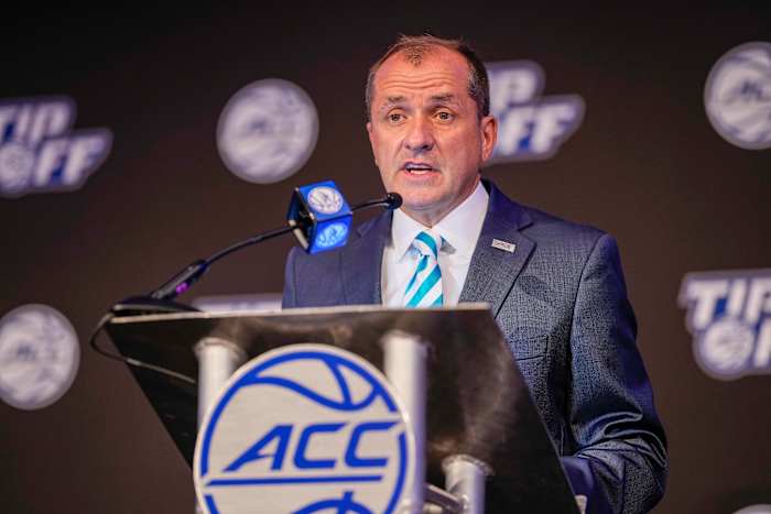 ACC commish Jim Phillips talks to reporters.