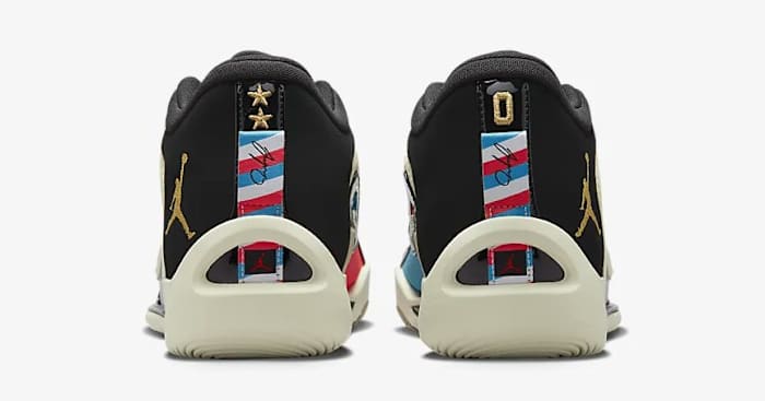 Rear view of white, black, and red Jordan Tatum 1 sneakers.