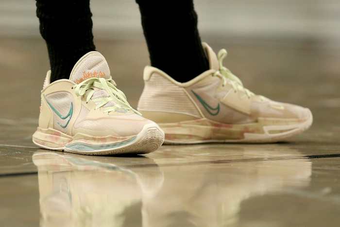 View of Kyrie Irving's tan Nike shoes.