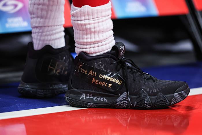 View of Kyrie Irving's black Nike shoes.