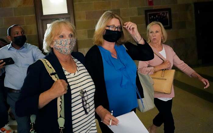 Favre texted frequently with New (second from right), who oversaw millions of dollars of welfare distribution in Mississippi.