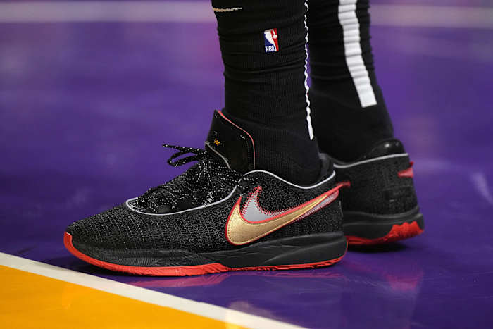 View of LeBron James' black and red Nike shoes.