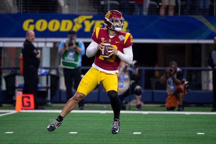 Jan 2, 2023; Arlington, Texas, USA; USC Trojans quarterback Caleb Williams (13) in action during the game between the USC Trojans and the Tulane Green Wave in the 2023 Cotton Bowl at AT&T Stadium. Mandatory Credit: Jerome Miron-USA TODAY Sports