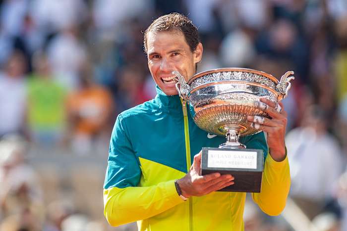 Rafael Nadal poses with his 14th French Open title trophy.