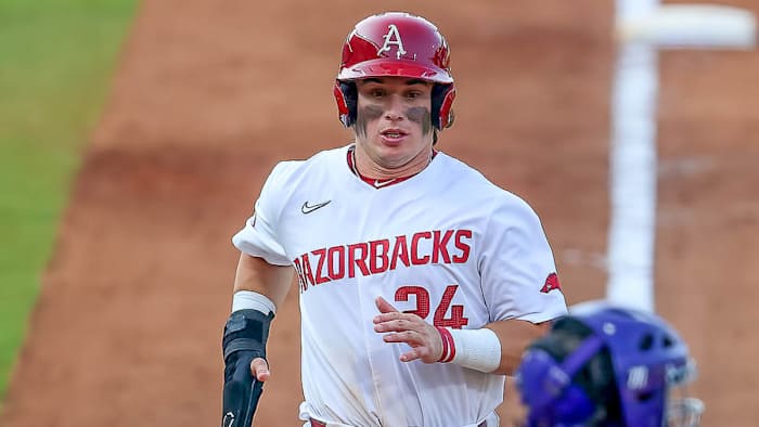 Razorbacks second baseman Peyton Holt comes home during 5-4 win over LSU Tigers on Thursday
