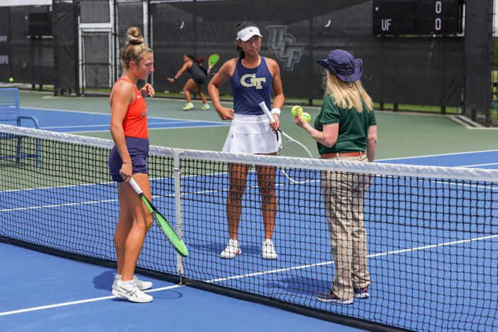 Junior Carol Lee discusses with official during her Round of 16 matchup against Auburn's Carolyn Ansari