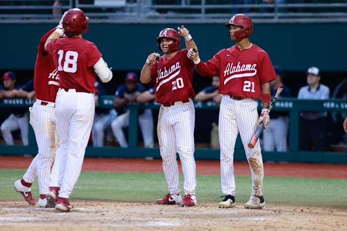 Alabama baseball player Tommy Seidl (20), Alabama baseball player Andrew Pinckney (21), Alabama baseball player Drew Williamson (18) celebrates against Ole Miss at Sewell-Thomas Stadium in Tuscaloosa, AL on Friday, May 19, 2023.