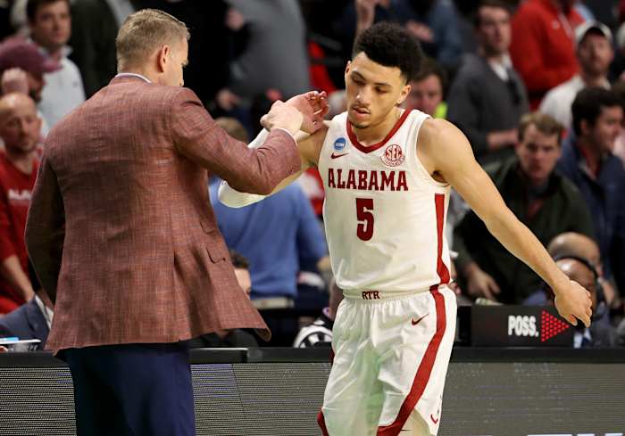 Mar 18, 2023; Birmingham, AL, USA; Alabama Crimson Tide head coach Nate Oats congratulates guard Jahvon Quinerly (5) during the second half against the Maryland Terrapins at Legacy Arena.
