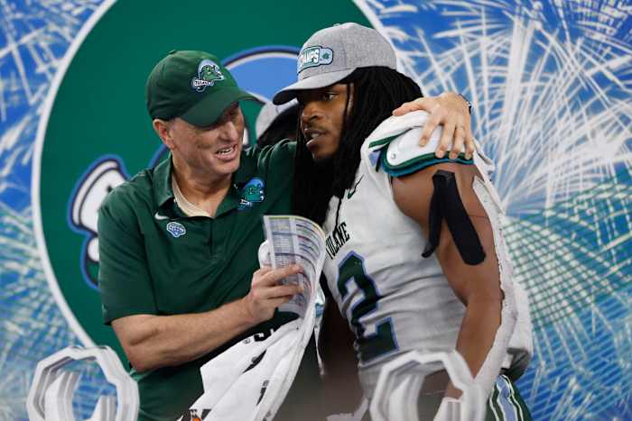 Jan 2, 2023; Arlington, Texas, USA; Tulane Green Wave head coach Willie Fritz celebrates with Tulane Green Wave linebacker Dorian Williams (2) after the game against the USC Trojans in the 2023 Cotton Bowl at AT&T Stadium. Mandatory Credit: Tim Heitman-USA TODAY Sports