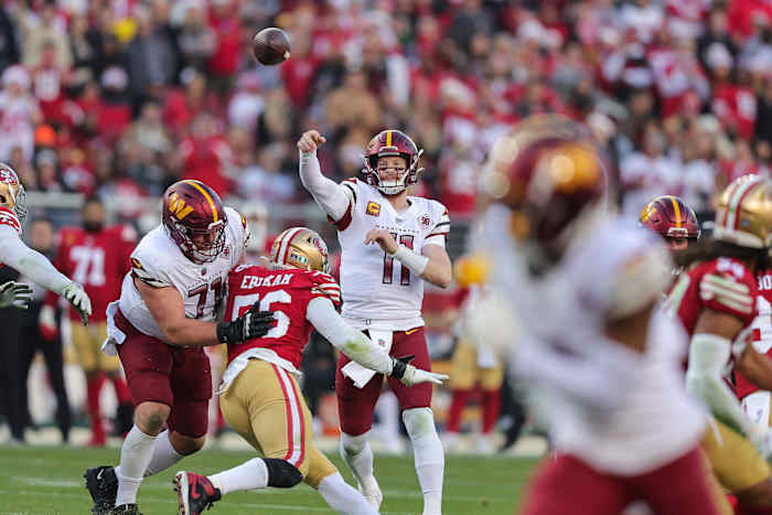 Carson Wentz throwing a pass for the Commanders