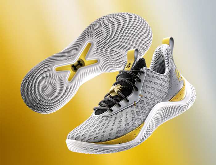 Detailed look at Stephen Curry's grey and gold shoes.