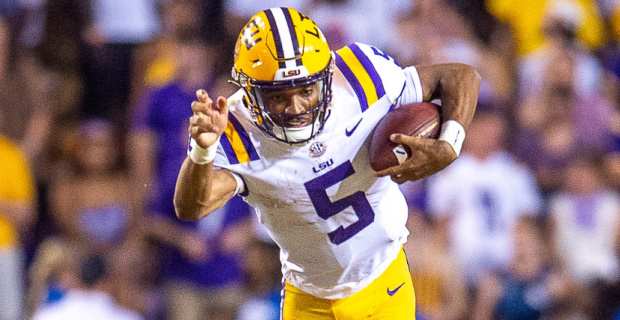 LSU Tigers quarterback Jayden Daniels on the run in a college football game in the SEC.
