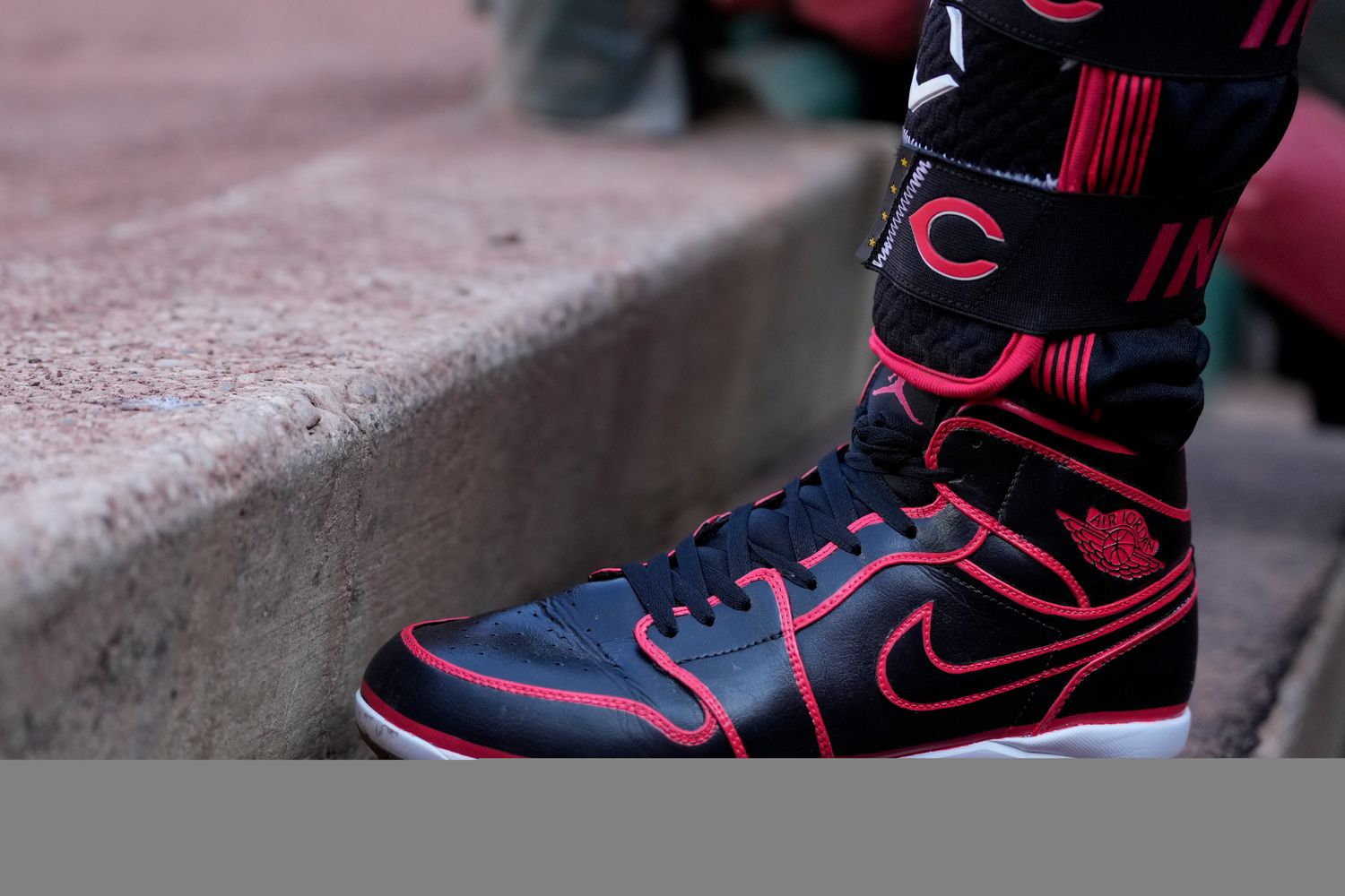 View of Jonathan India's black and red Air Jordan baseball cleats.