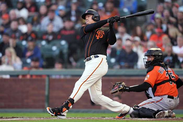 SF Giants designated hitter Wilmer Flores hits a double against the Baltimore Orioles at Oracle Park on June 3, 2023.